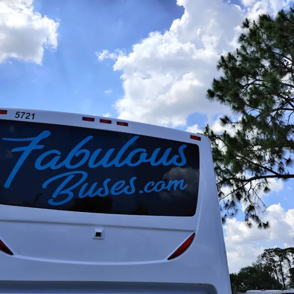 a bus parked in front of a sign
