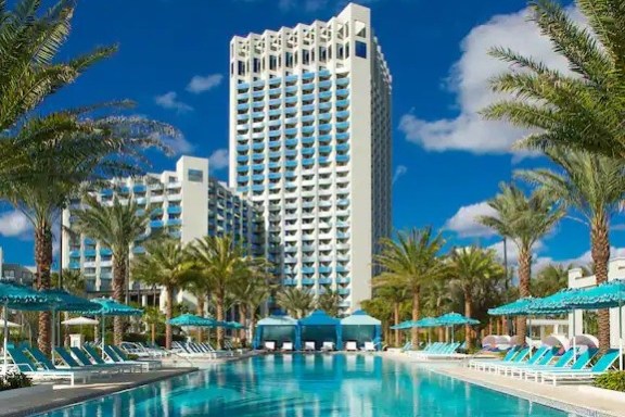 a large pool of water and large white building